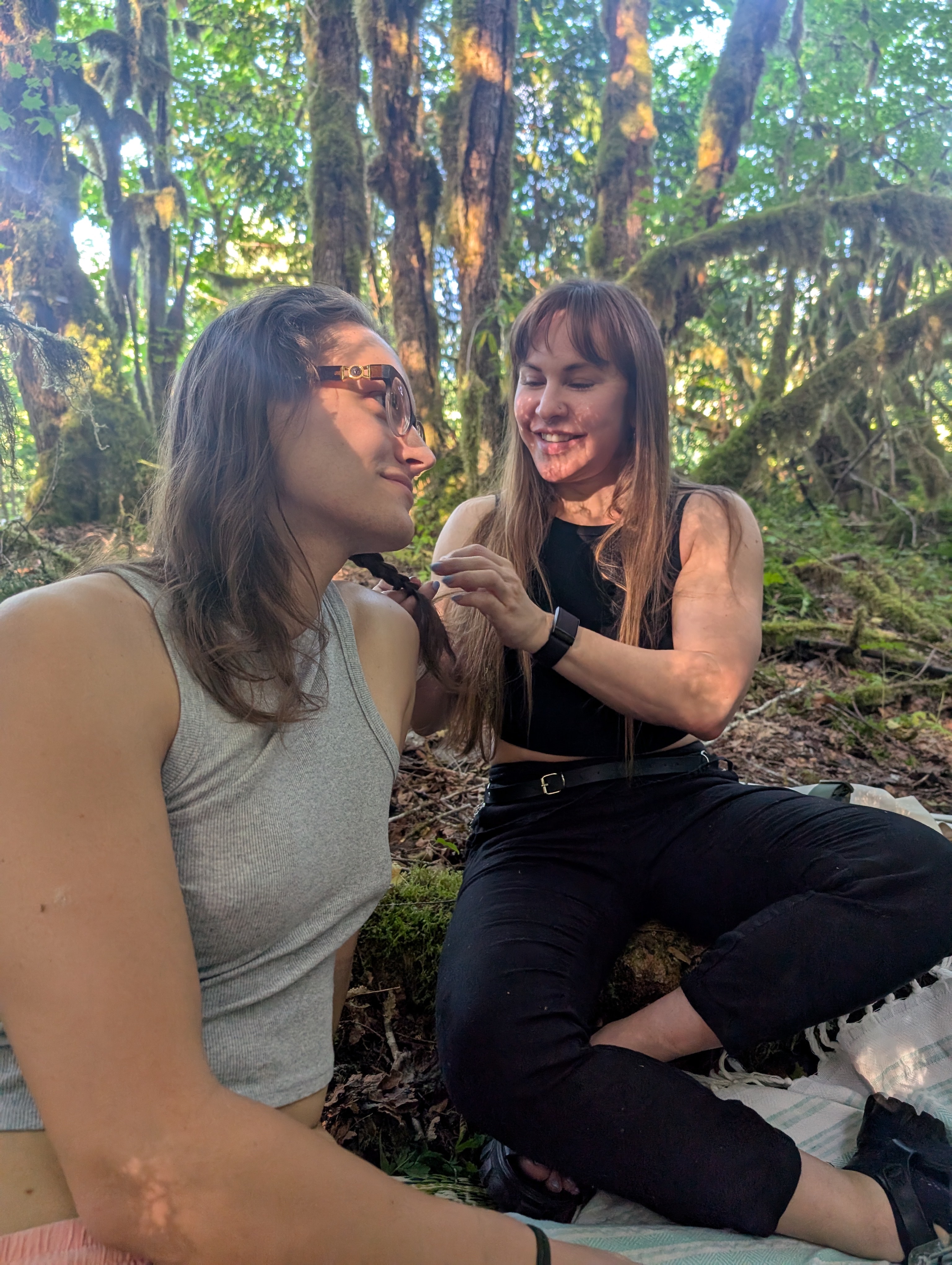 Mars reaching tenderly toward Andrea in an old-growth forest